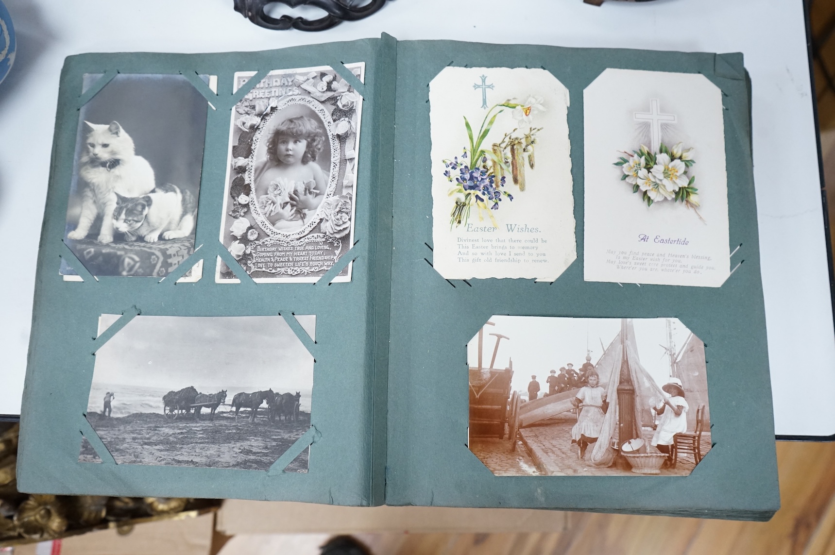 A postcard album to include greetings cards and topographical examples